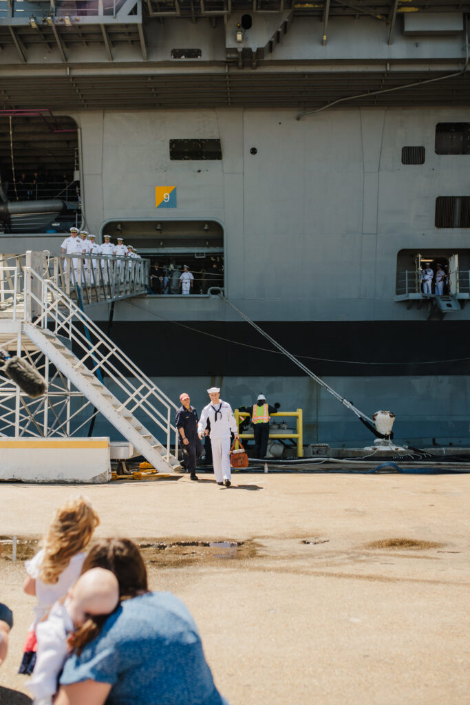 Sailor walking off the USS George H W Bush